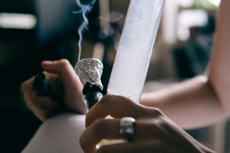 A person using a bong