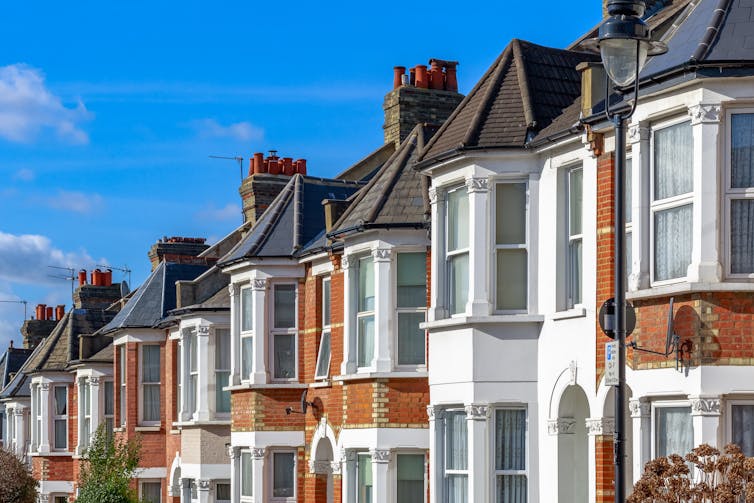 Row of Victorian terraced houses with large sash windows