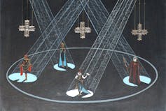 Set design feature four of Hamlet's characters in a round lit by spotlights with crosses hanging above.