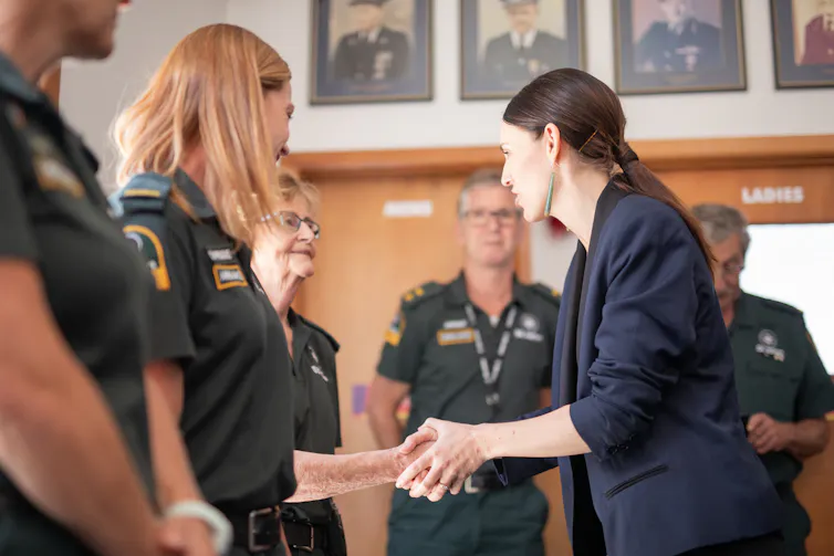 ambulance officers with Jacinda Ardern