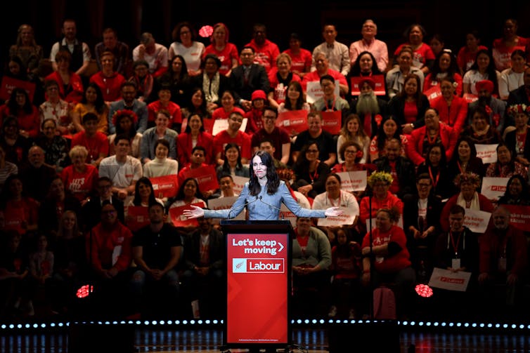 Jacinda Ardern speaking with crowd behind