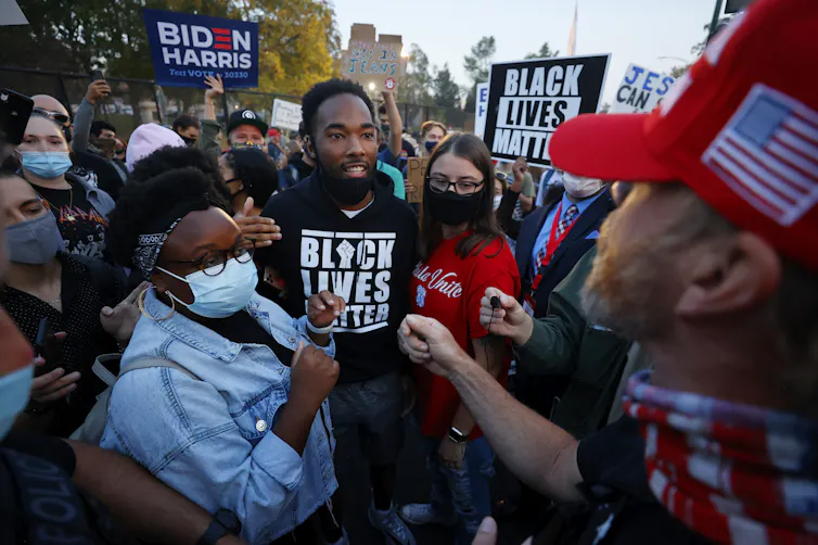 Biden and Trump supporters clash prior to the vice-presidential debate in Salt Lake City on October 7 2020.