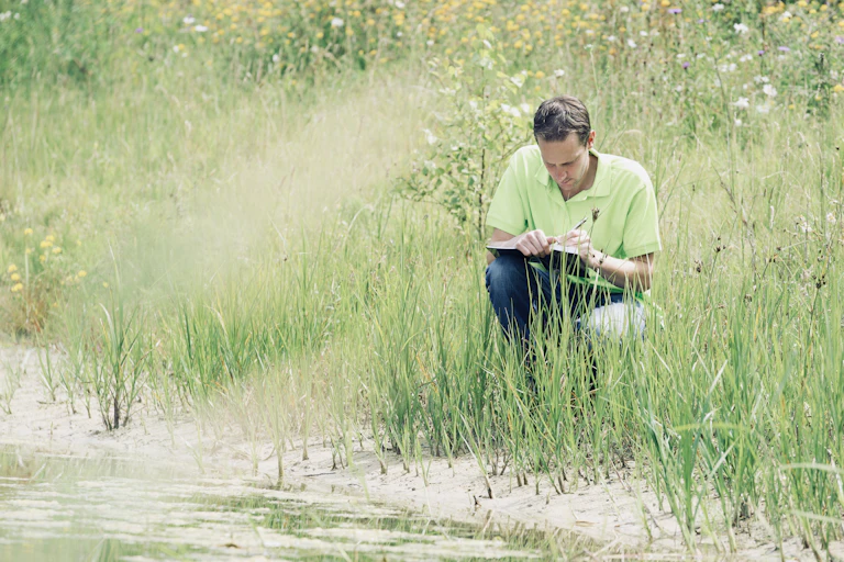 Scientist records field notes