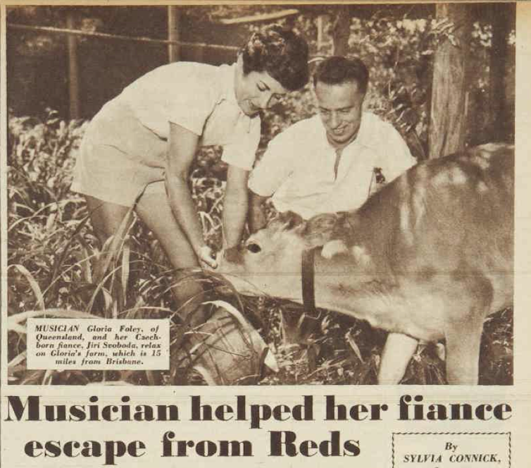 A man and a woman feed a calf. Magazine headline reads: musician helped her fiancé escape from Reds.