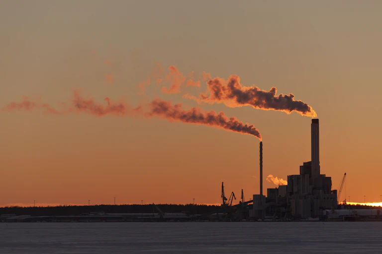 Power plants releasing smoke.