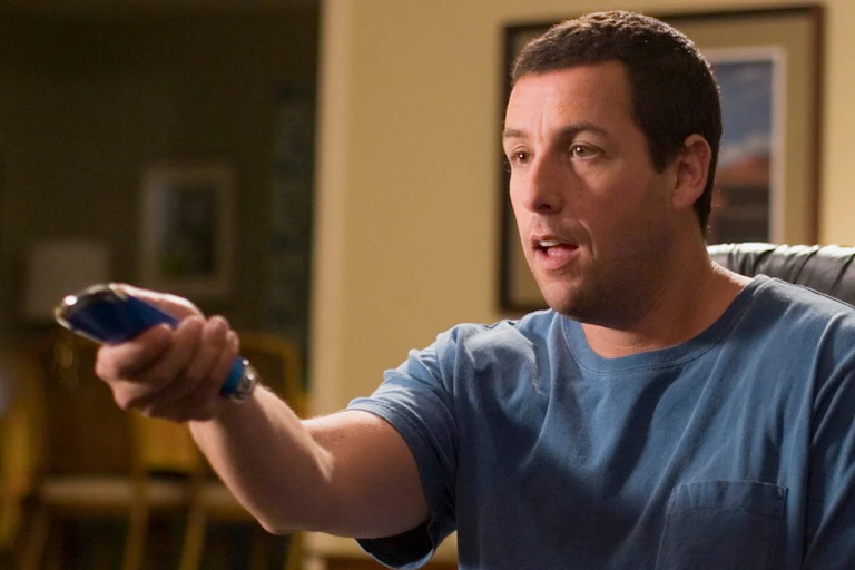 Movie sill: Adam Sandler points a remote