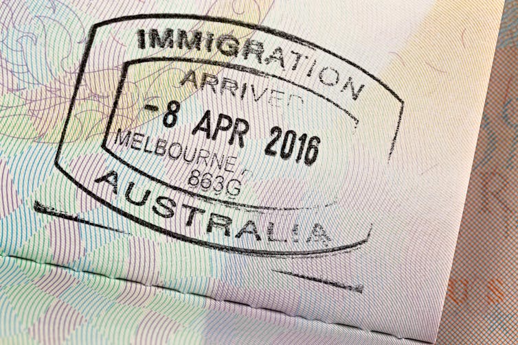 Passport stamp, showing 'immigration, arrived in Melbourne 2016'.