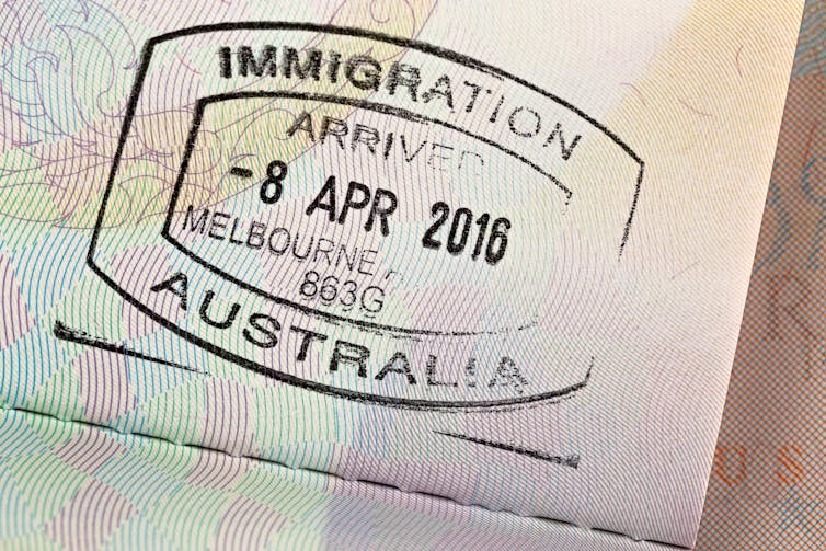 Passport stamp, showing 'immigration, arrived in Melbourne 2016'.