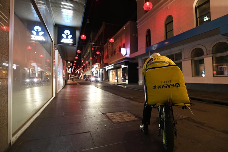 A delivery rider in Melbourne's CBD, August 8 2020.