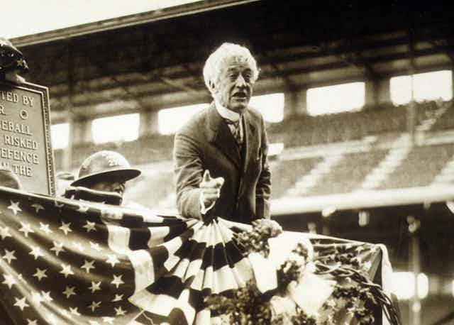 Major League Baseball commissioner Landis speaks at Wrigley Field in Chicago during a ceremony honoring World War I veterans.