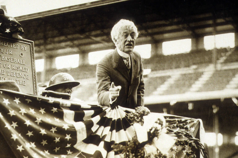 Major League Baseball commissioner Landis speaks at Wrigley Field in Chicago during a ceremony honoring World War I veterans.