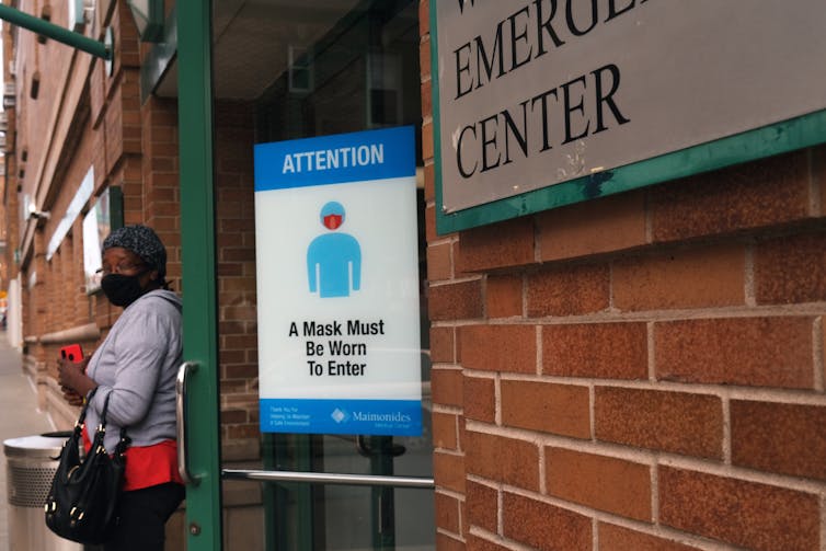 exterior of a medical center with mask sign