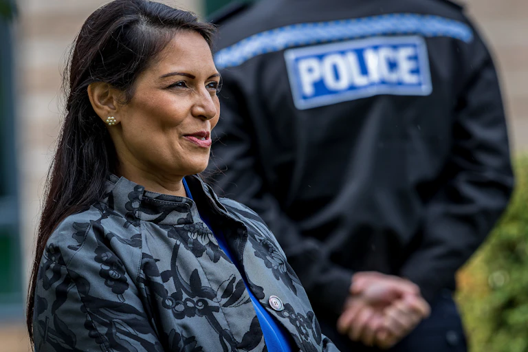 Home Secretary Priti Patel visits with police.