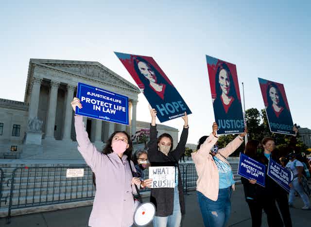 A group of anti-abortion activist women demonstrating in front of the Supreme Court.