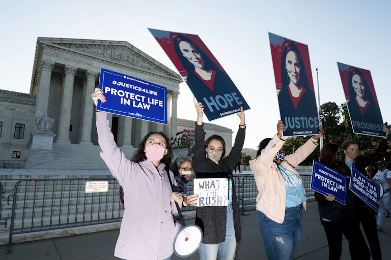 A group of anti-abortion activist women demonstrating in front of the Supreme Court.