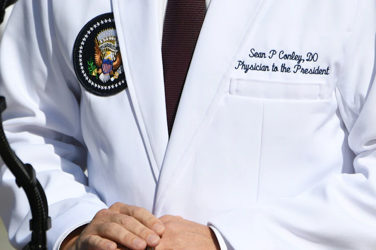 Dr. Conley's white coat with DO credential