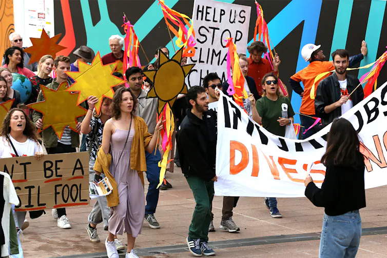 University students march to demand action on climate change