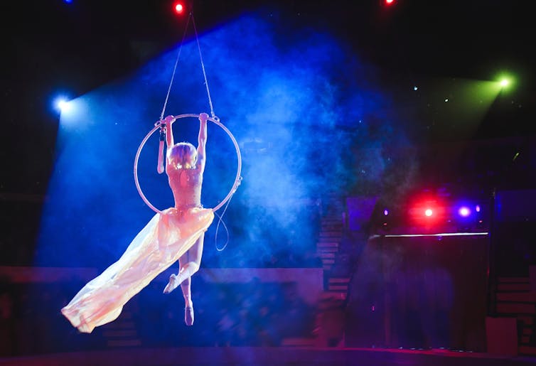 Woman acrobat performing at circus