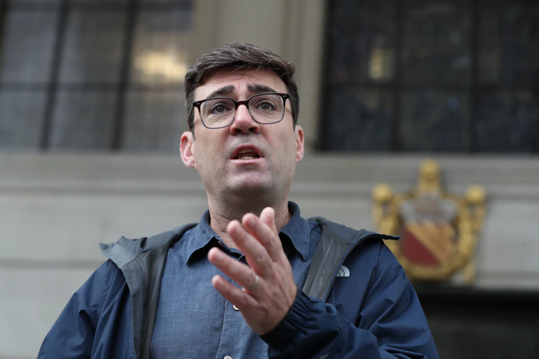 Manchester mayor Andy Burnham holding a press conference.