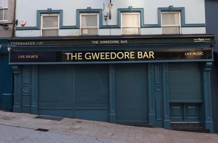 A closed bar in Northern Ireland, with its shutters down.