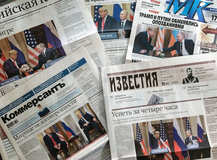 Front pages of Russia's main newspapers featuring pictures of the 2018 summit between Donald Trump and Russian President Vladimir Putin in Helsinki, Finland.