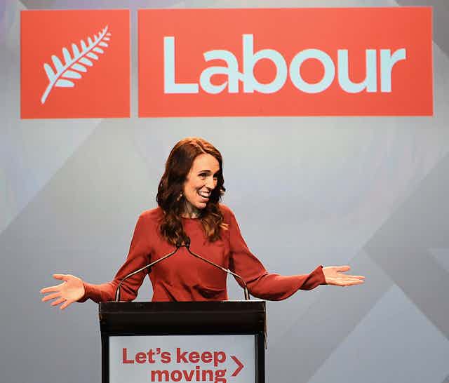 Jacinda Ardern at the podium accepting victory on the election.