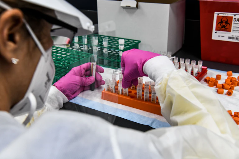 A person in a vaccine lab.