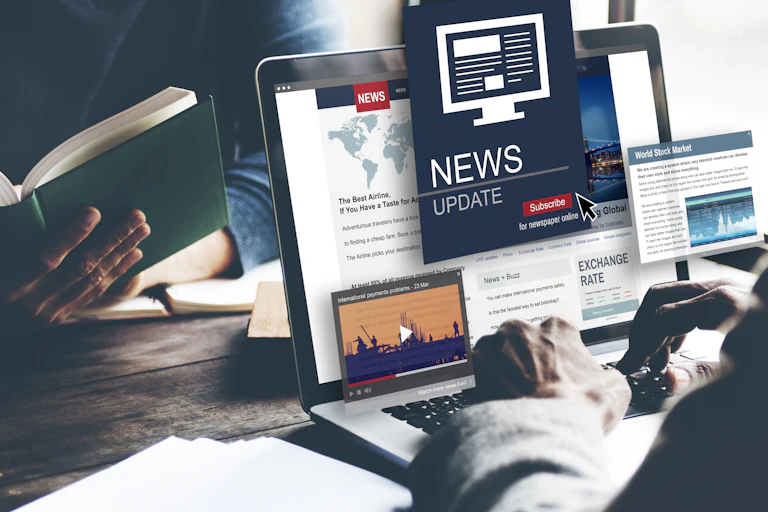 Laptop with a news website tabs open