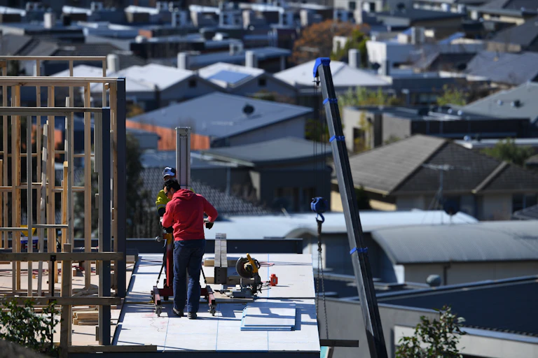 Workers on a home building site