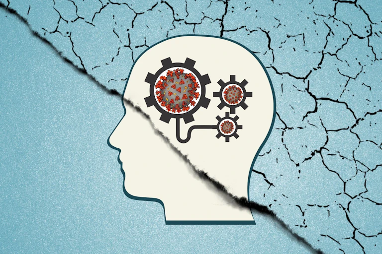 Silhouette of a head with gears containing coronaviruses against a cracked background.
