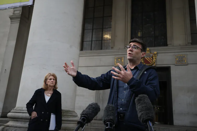 Andy Burnham holding a press conference