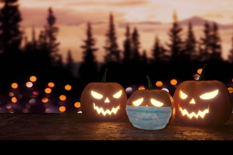 Jack-o-lanterns, one with a face mask.