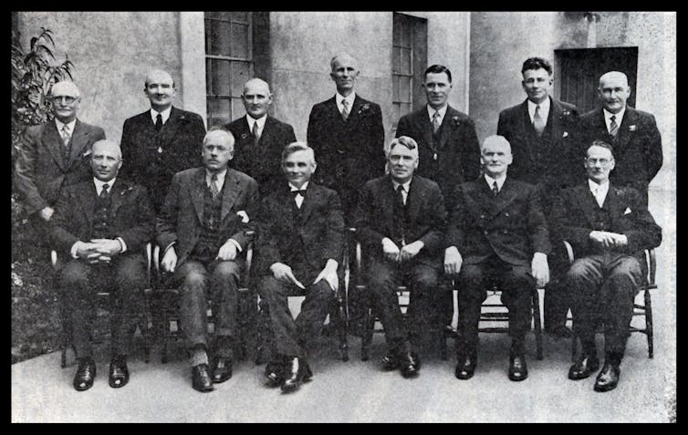 men from the 1930s seated and standing