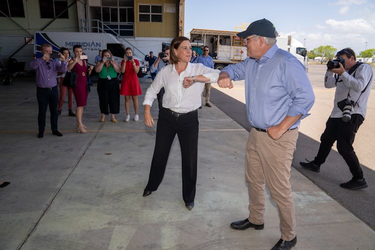 LNP leader Deb Frecklington elbow bumps Prime Minister Scott Morrison.