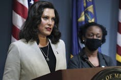 Michigan Gov. Gretchen Whitmer is seen speaking at a podium.