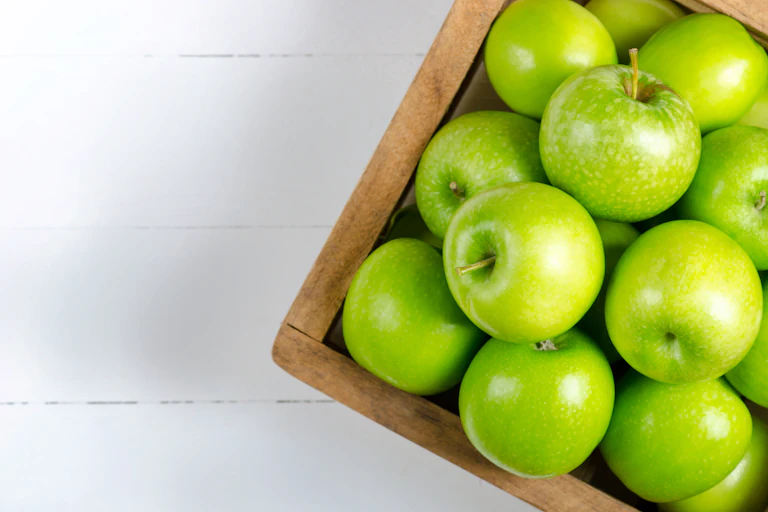 A box of green apples.