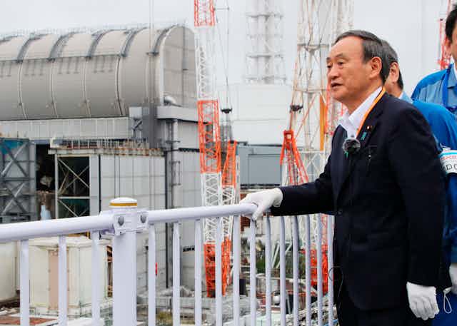Japan's Prime Minister inspects a water tank in Fukushima 