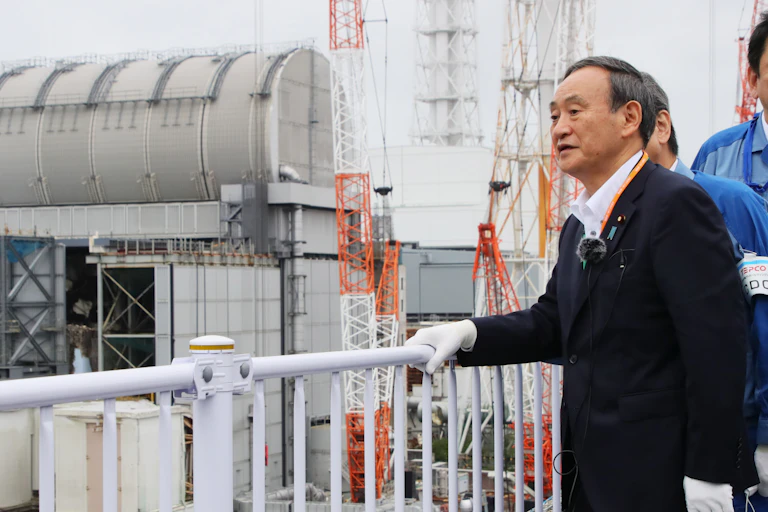 Japan's Prime Minister inspects a water tank in Fukushima