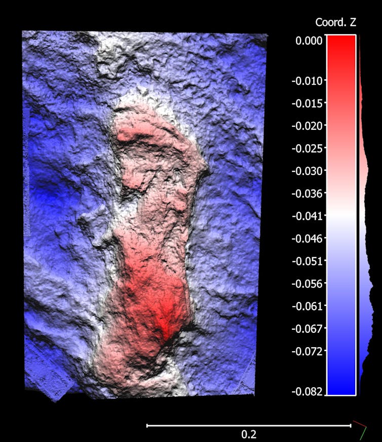 A footprint is highlighted in red against a blue backdrop