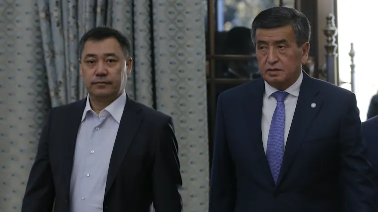 Kyrgystan's new president Sadyr Japarov, standing with the president he ousted, Sooronbay Jeenbekov