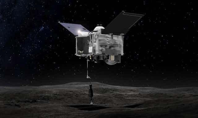 Artist's drawing of OSIRIS REx collecting material from Bennu.