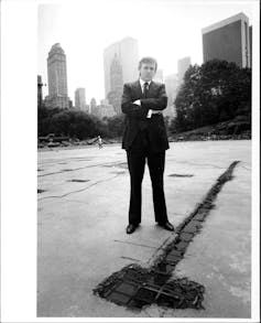 Black and white image of Trump with skyscrapers in the background