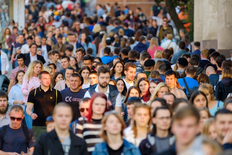 people walking on a crowded street