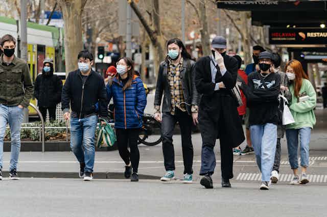 People donning masks in Melbourne, Australia