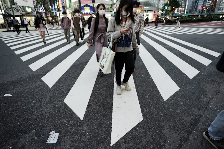 People wearing facemasks in Tokyo, Japan