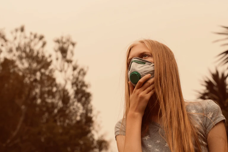 Teenage girl wearing face mask