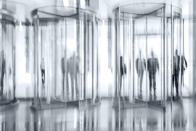 Blurry revolving doors in office foyer