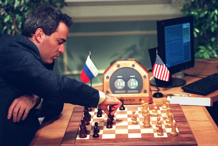 Kasparov at a chessboard with no person opposite