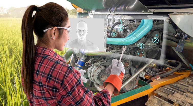 Young female farmer use AR glasses to fix a machine with digital screen