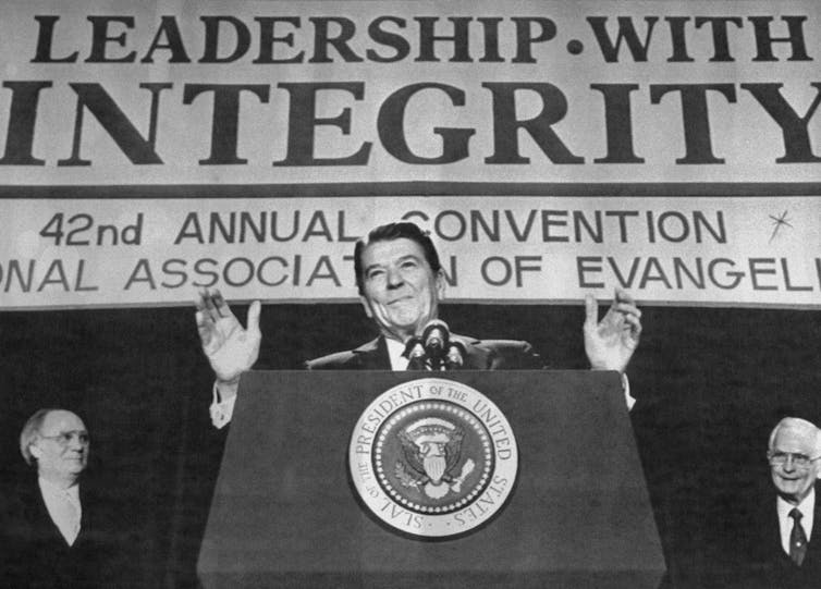 President Ronald Reagan gestures as he speaks to the National Association of Evangelicals